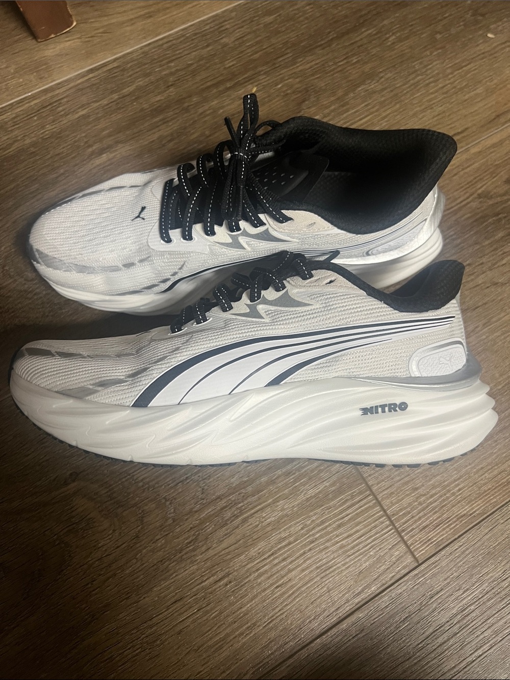 Puma Woman’s White and Black Nitro Running Shoes